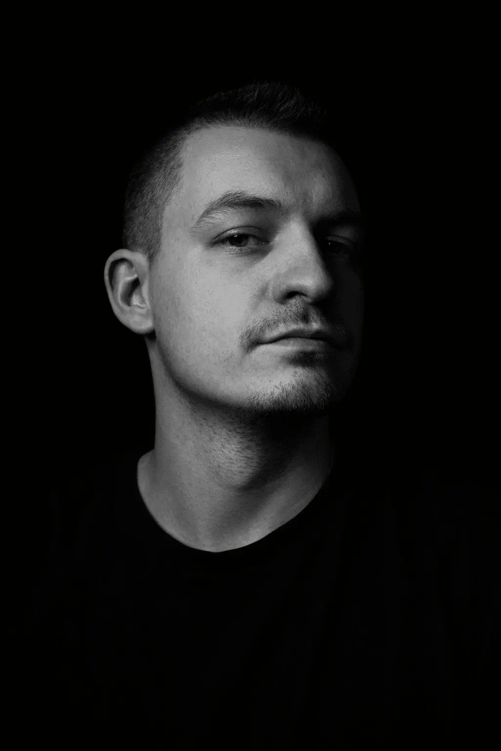 A low-key light photography of Daniel